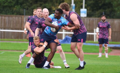 Wigan Warriors training on the athletics infield during a three-day camp at the University of Bath in September 2024.